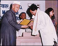 Receiving "National Award" form honorable President of India Shankar Dayal Sharma(1992).